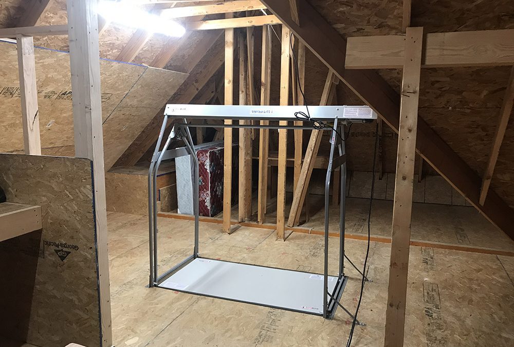 attic lift in an attic.